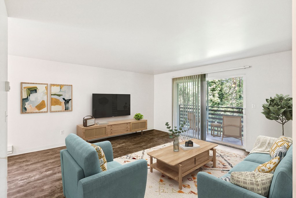 a living room with couches and a coffee table and a television