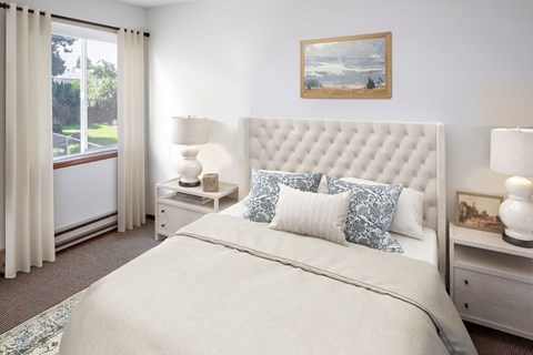 a bedroom with a bed and two night stands