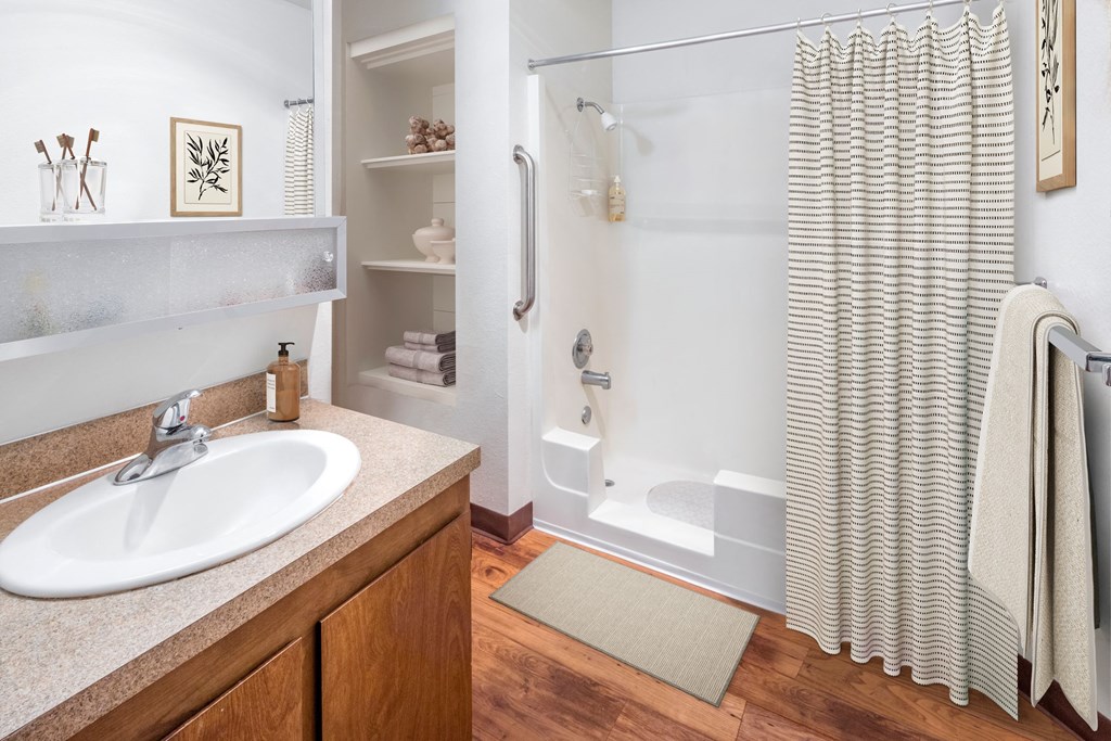 a bathroom with a shower and a sink