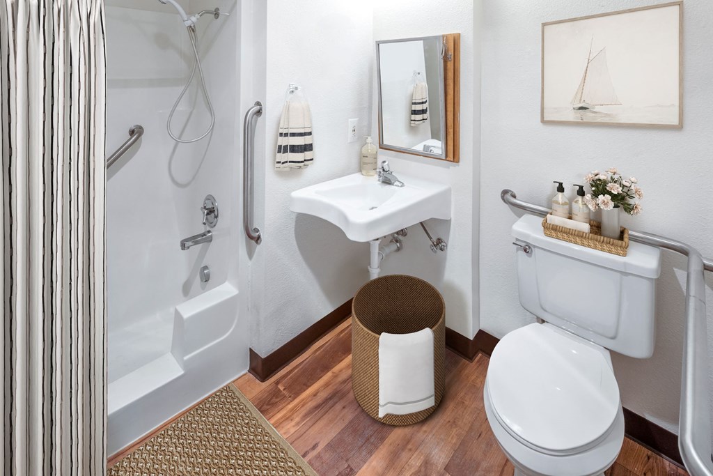 a bathroom with a toilet sink and bathtub