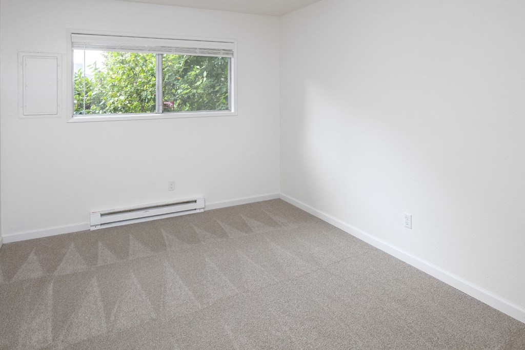 a small empty room with a window