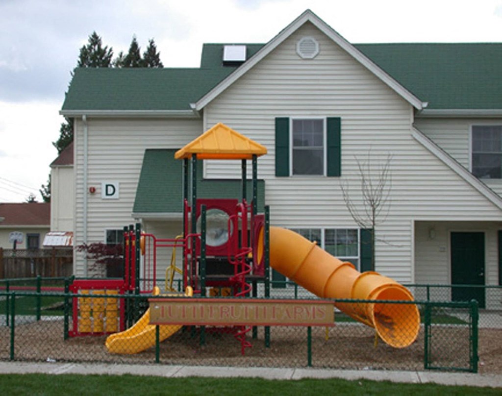 a playground in front of a house