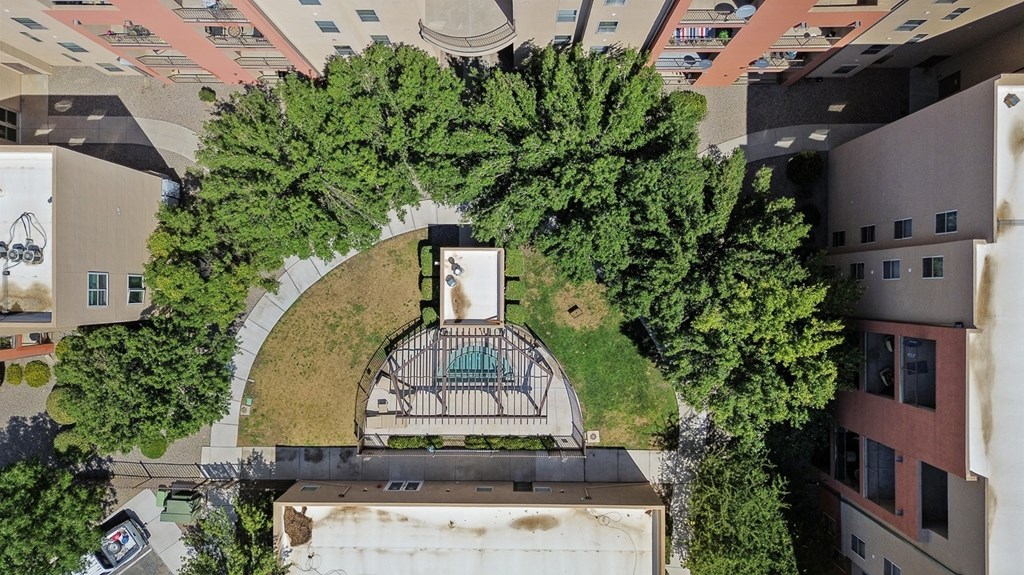 A bird's eye view of a courtyard surrounded by buildings.