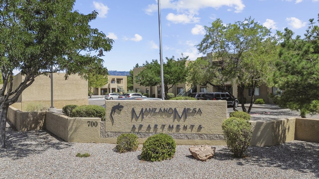 The image shows a sign for Navajo Casino in front of some buildings.