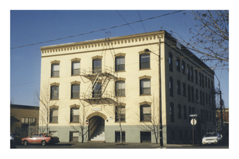 A large building with a fire escape on the side.