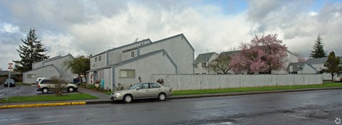 a car parked on a street in front of a house