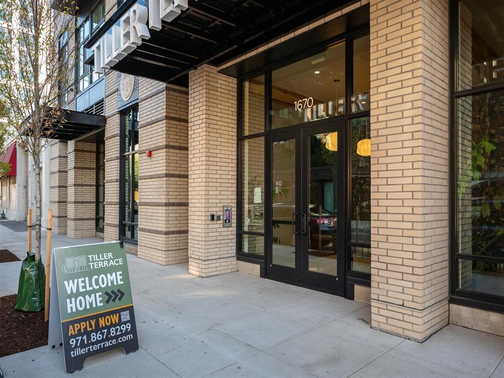 a building with a welcome home sign in front of it