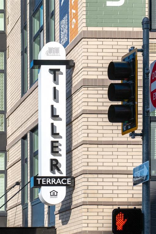 a traffic light and a sign on the side of a building
