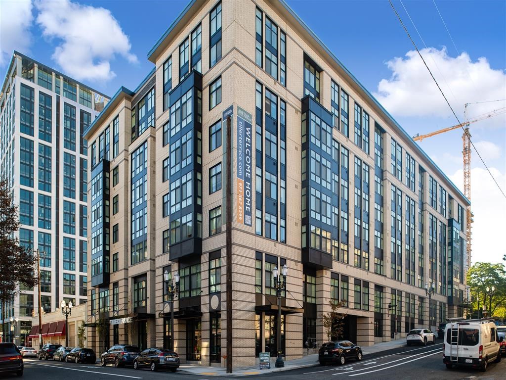 a large building on the corner of a city street