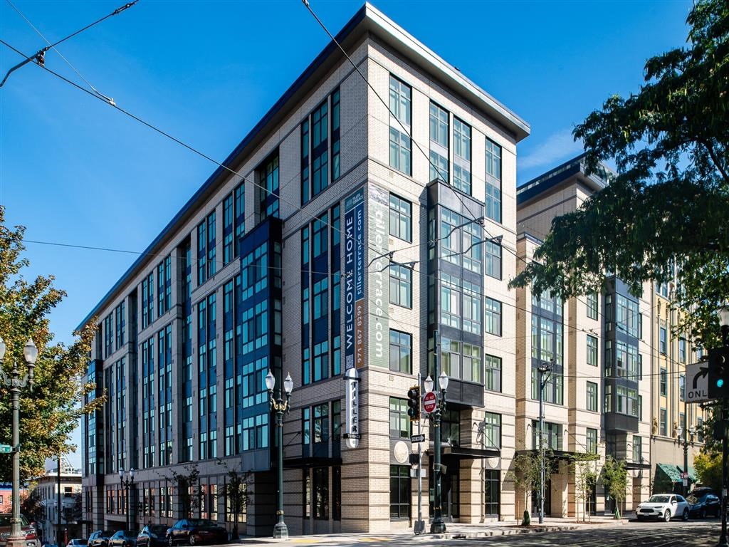 a large building on the corner of a city street