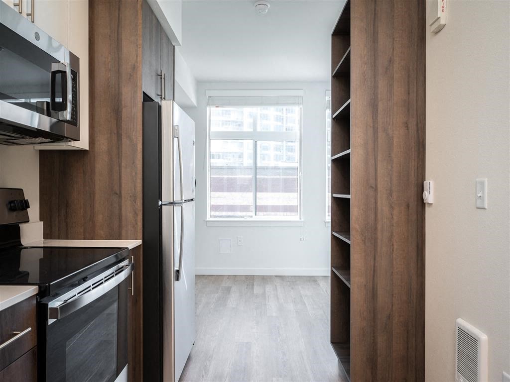 a kitchen with a large window and a