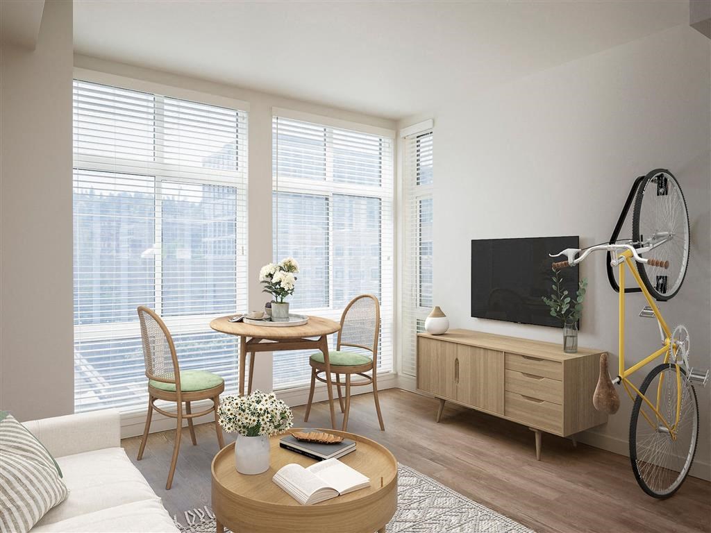 a living room with a couch and a table and a yellow bike