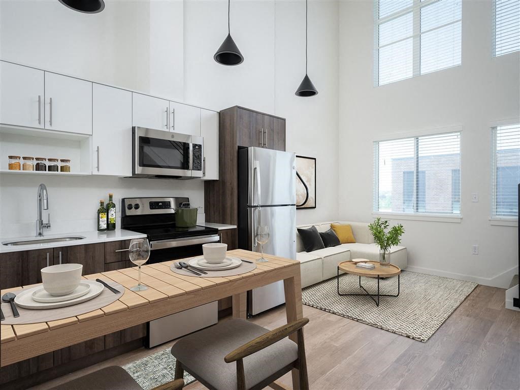 a kitchen and living room in an apartment