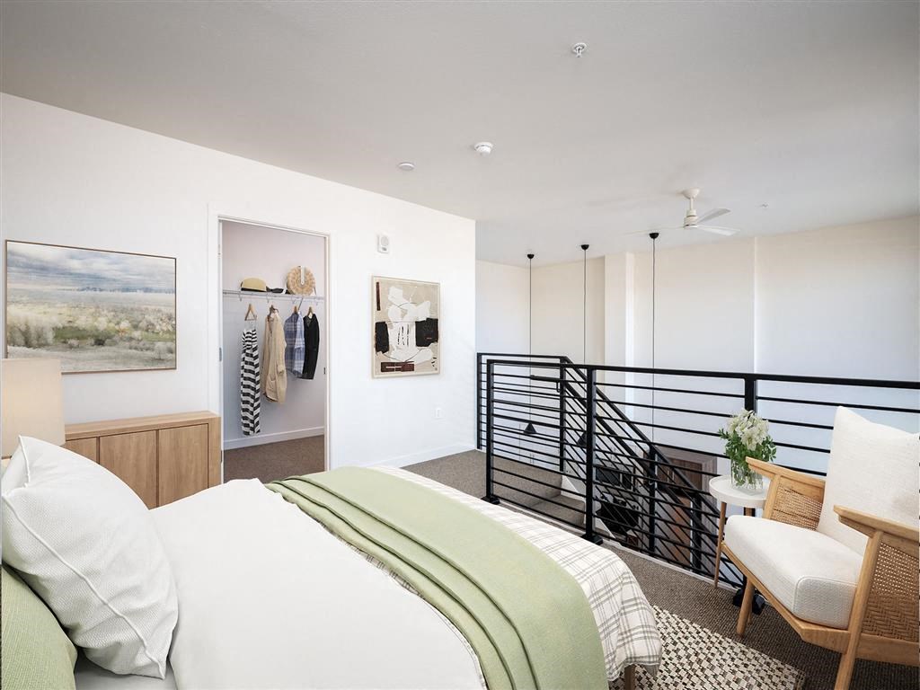 a bedroom with a bed and a balcony