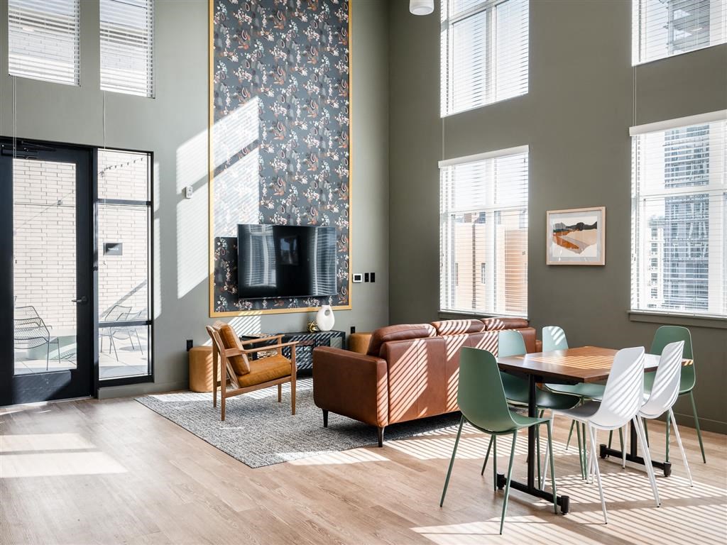 a living room with a couch and a table and a tv