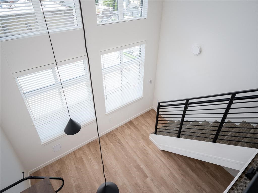 an overhead view of a bedroom with a bed and a window