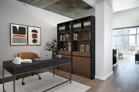 a home office with a desk and a laptop