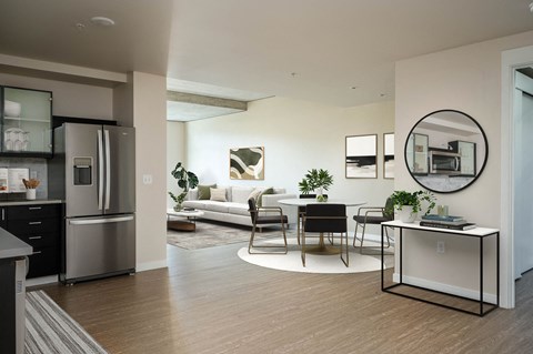 a living room with a kitchen and a dining room