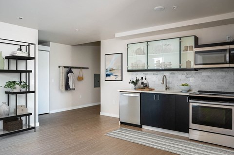 a kitchen with a sink and a stove and a window