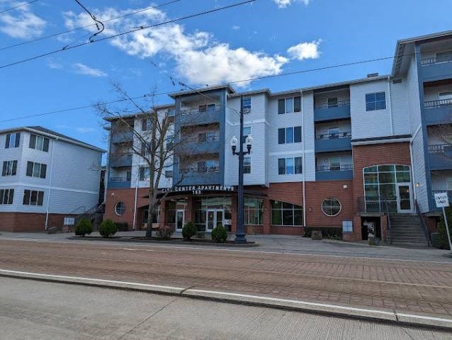 A street view of a building with the name "Chester Apartments" on it.