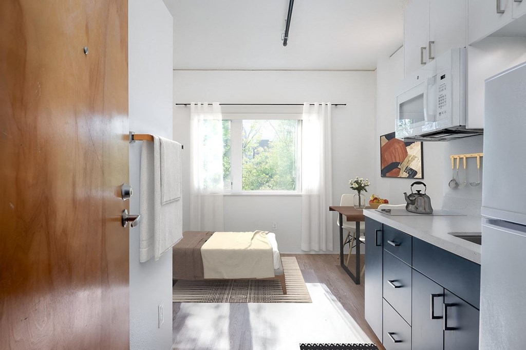 a small kitchen with a table and a window