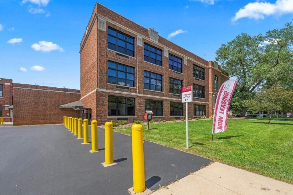 a view of the brick facade of Spartan Lofts in Sparta, WI