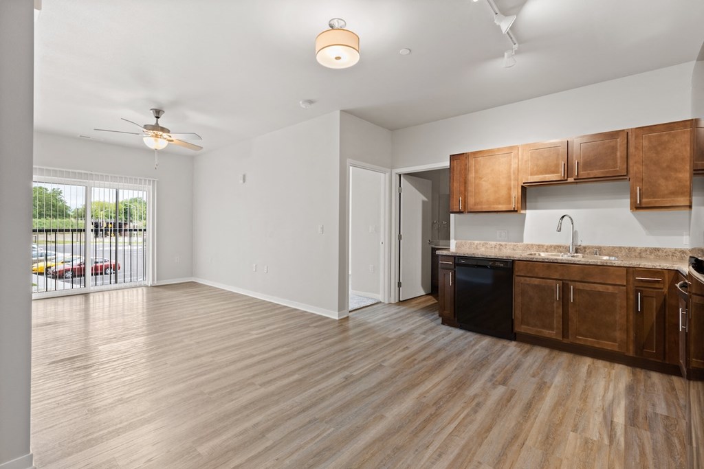 a spacious, open kitchen and living area in a River Flats Apartment