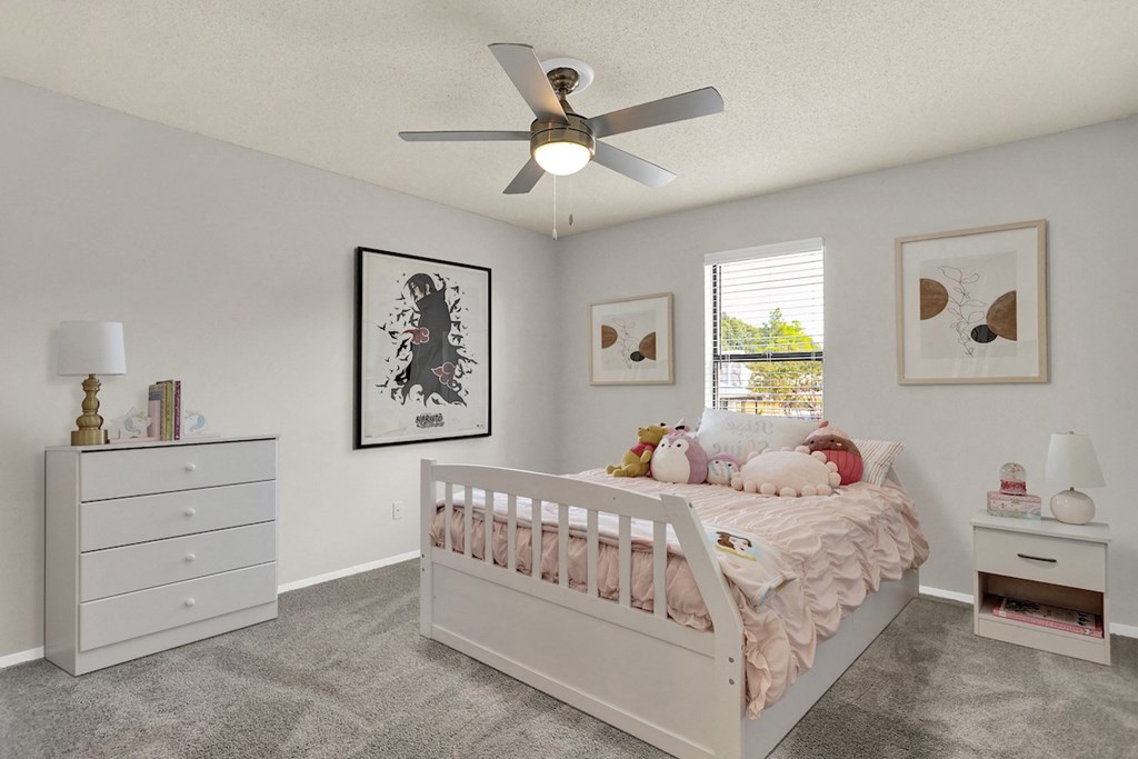 a carpeted bedroom with a ceiling fan, window, and virtual furnishings at Rock Creek