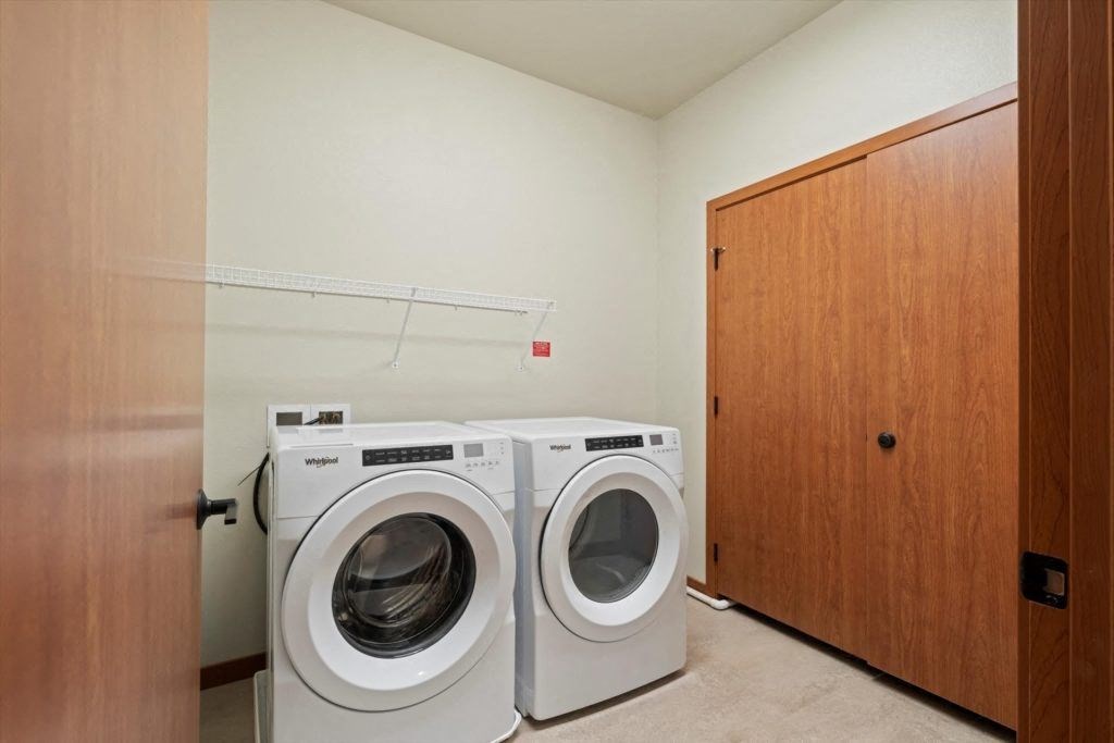 a washer and dryer in an in-home laundry room at Spartan Lofts