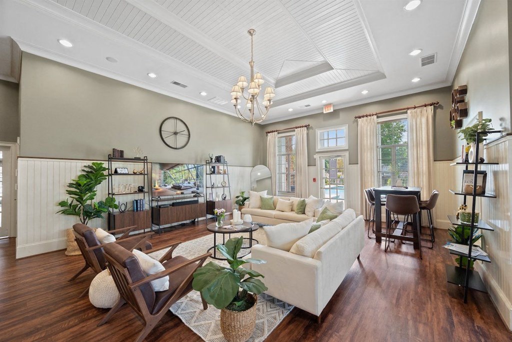 the clubhouse with wood floors, many couches, and lots of decor at Centerville Manor Apartments