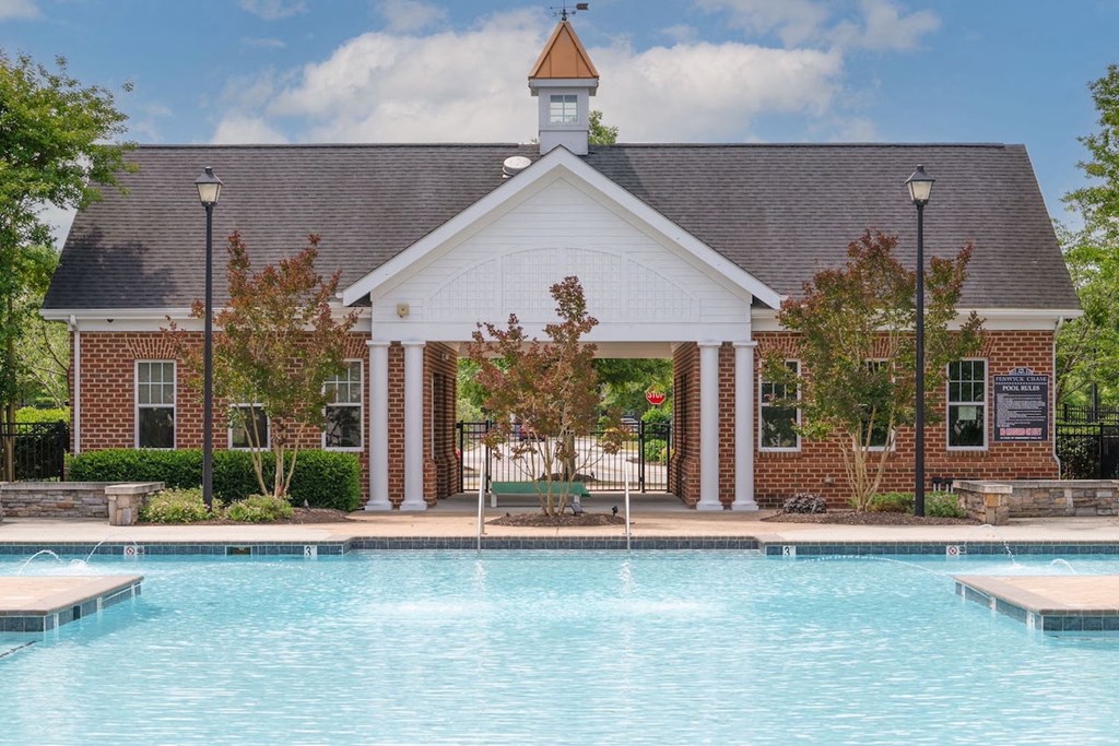 large beautiful pool in front of building at Fenwyck Manor Apartments in Chesapeake, VA