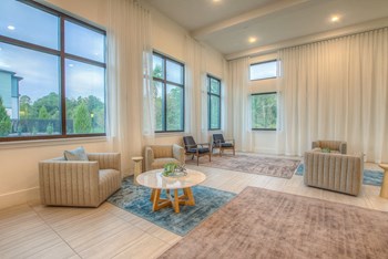 San-Marcos-Heights-Clubhouse-6 San Marcos Heights Clubhouse with ample seating, tables, and large windows with natural light - Photo Gallery 5