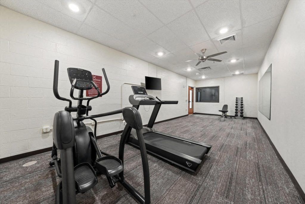the fitness center with cardio equipment at Spartan Lofts in Sparta, WI