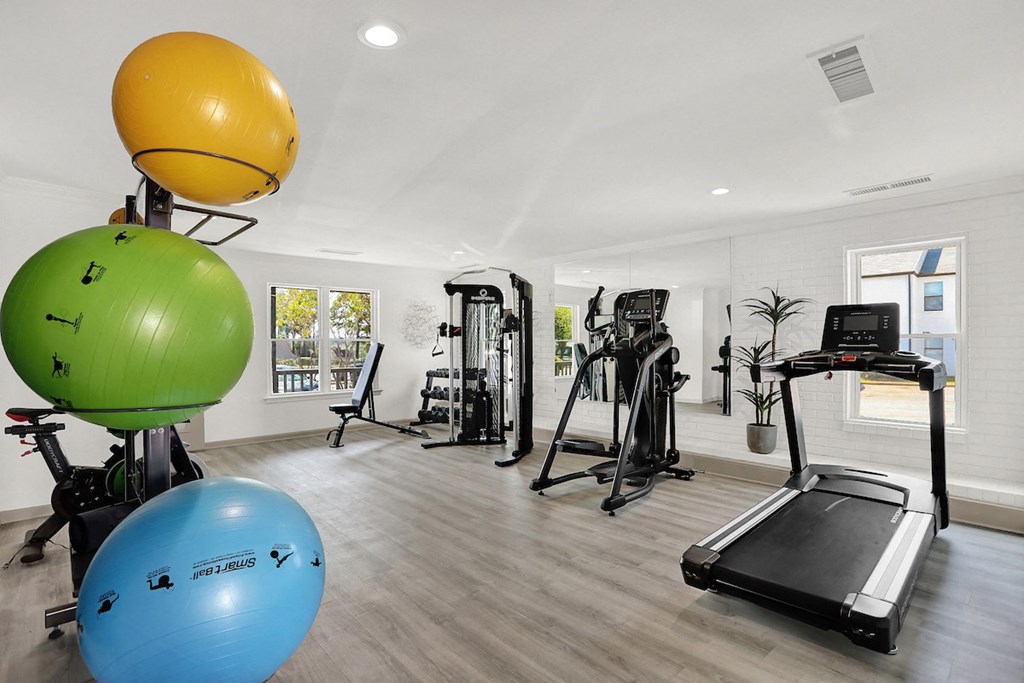 The newly renovated fitness center with strength, stretching, and cardio equipment at Rock Creek Apartments in Cordova, TN