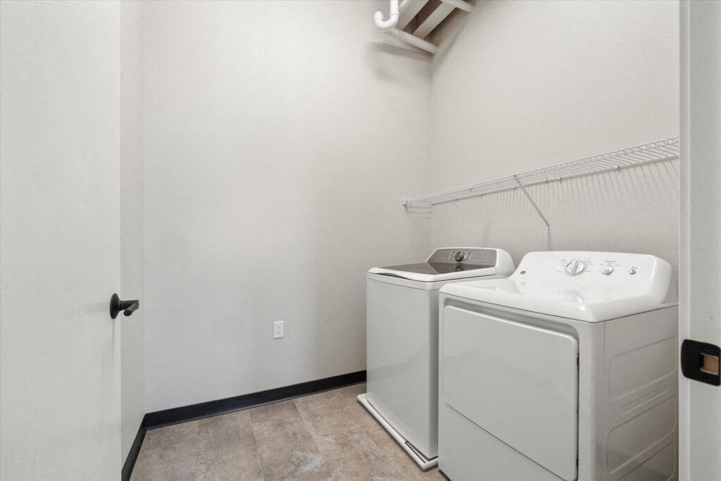 a washer and dryer in in a Brooke Street Loft in Fond du Lac, WI
