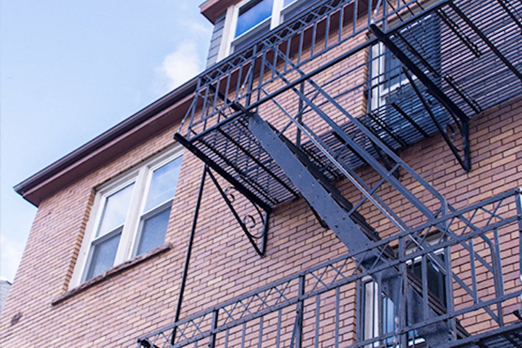 brick apartments with black fire escape at 361-77 Busti Ave in Buffalo, NY