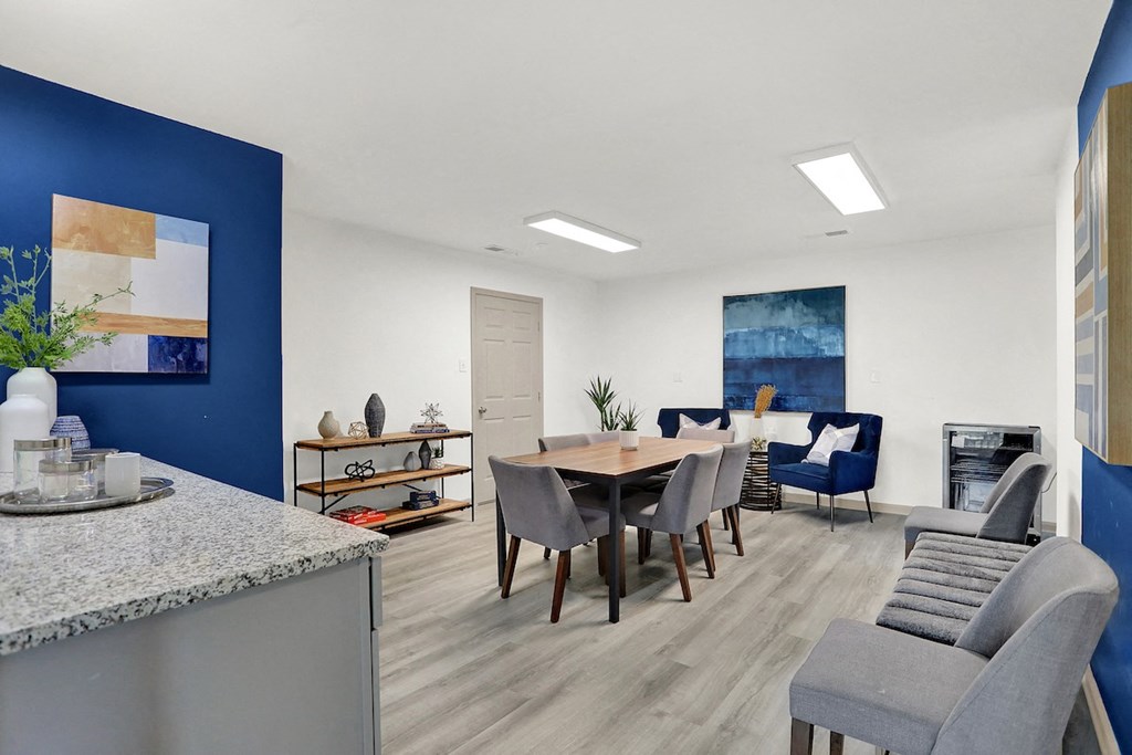 The newly renovated clubhouse with ample seating and a conference table at Rock Creek Apartments