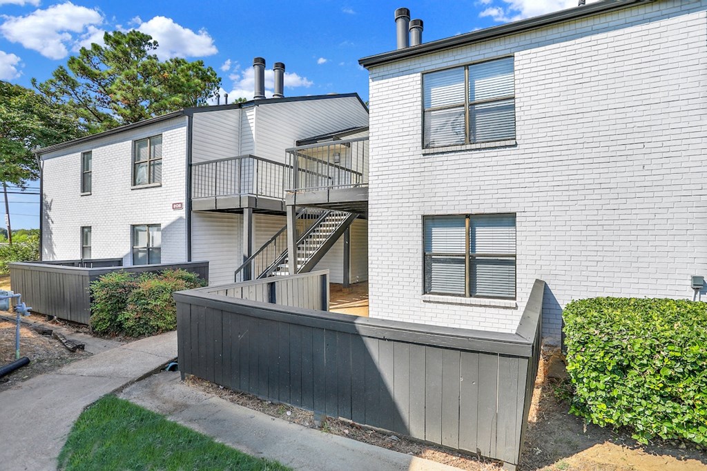 newly painted exteriors and lushly landscaped residential buildings
