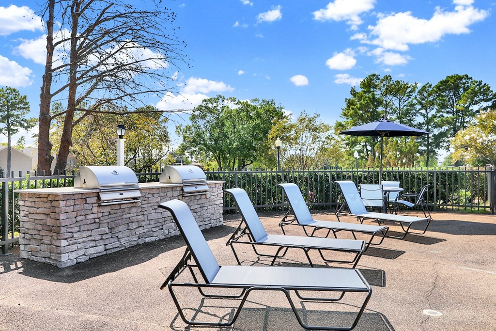 the new lounge chairs by the double grilling station at Rock Creek Apartments