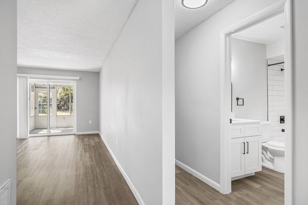 A white bathroom with a toilet and sink.