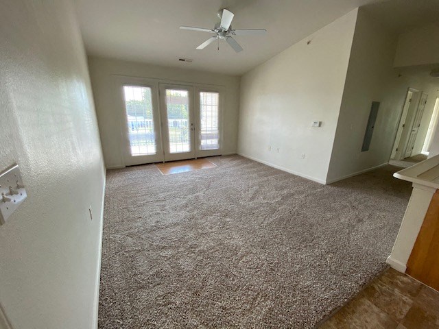 living room with plush carpeting and ceiling fan
