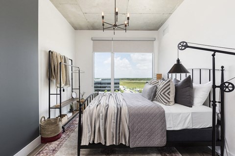 bedroom with large window and high ceiling at Lake Nona Pixon, Orlando, Florida