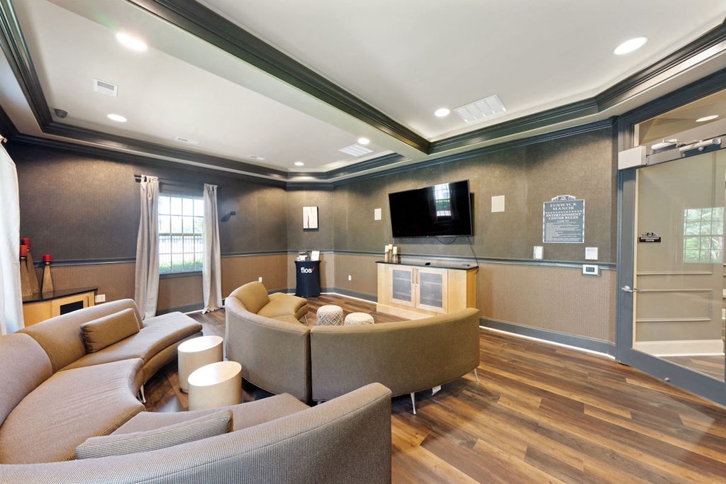 Media room with TV and ample seating at Fenwyck Manor