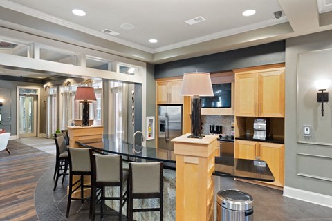 a kitchen and dining room with a table and chairs