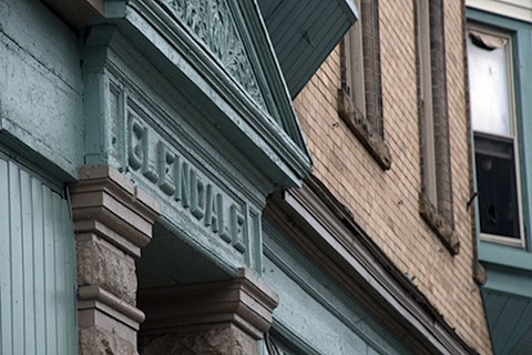 76GrantSt brick apartment building with a green and brown facade at 76 Grant St in Buffalo, NY