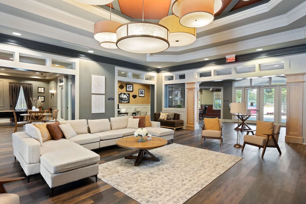 clubhouse lounge at Fenwyck Manor with comfortable furniture, large windows, and decor