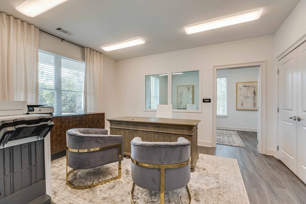a living room with a bar and two chairs