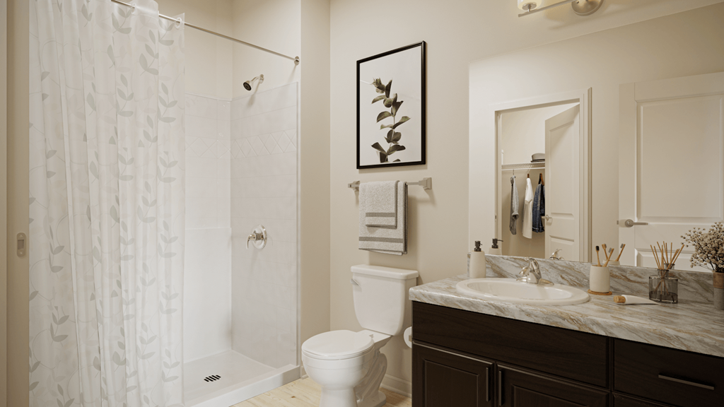 a large bathroom with a shower, toilet, and spacious sink vanity