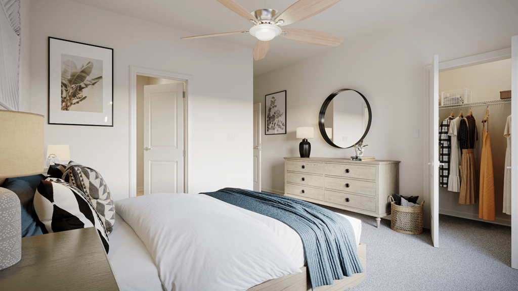 a bedroom with a large closet and model furnishings at Archer Green in Augusta, GA