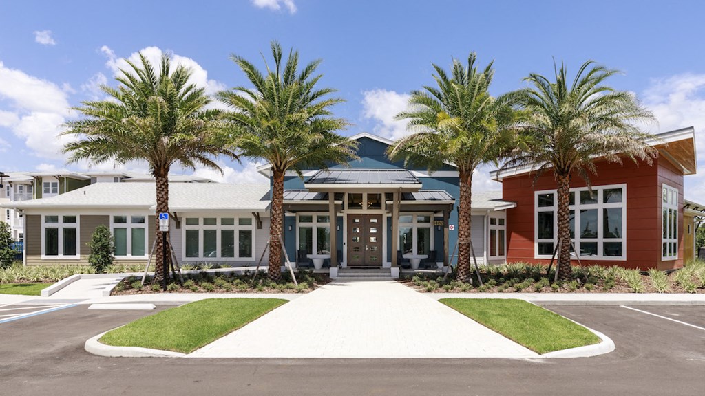Clubhouse exterior with beautiful palm trees